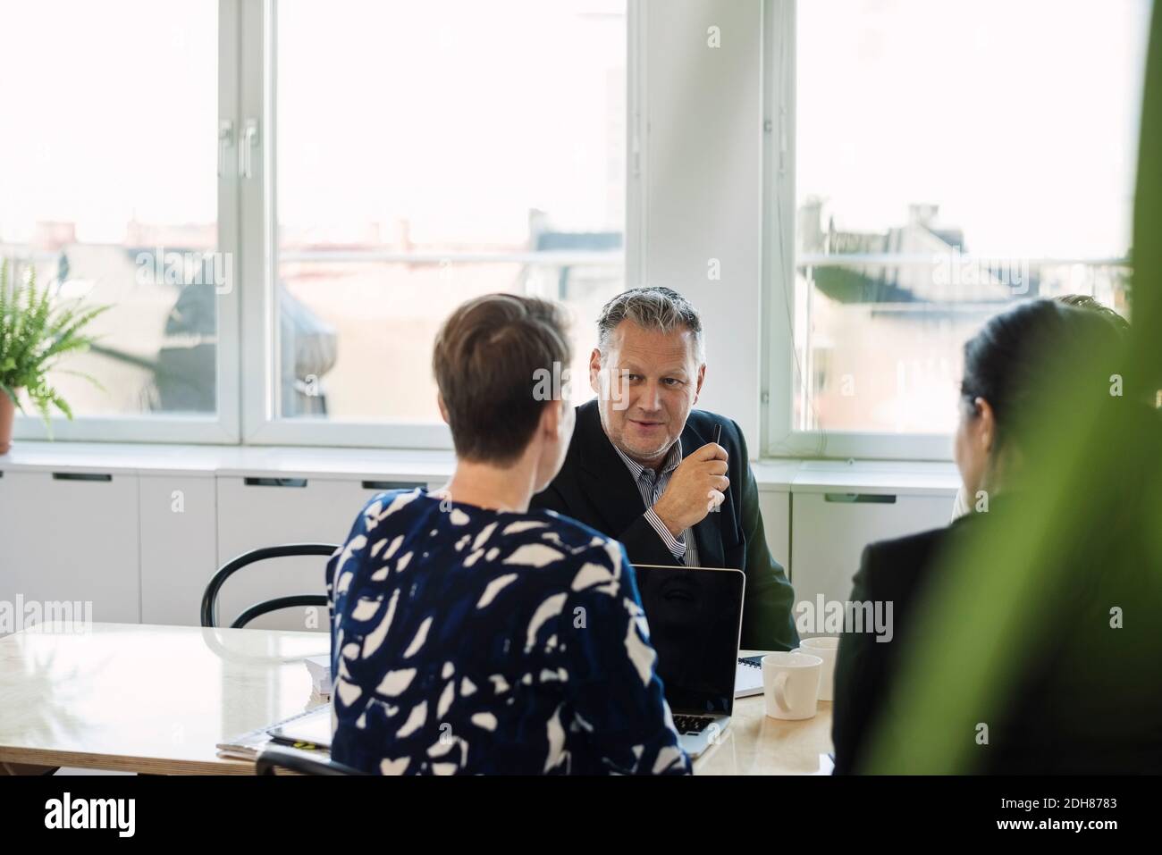 Been Discussing Strategy teamwork table discussing hi-res stock photography and images ...
