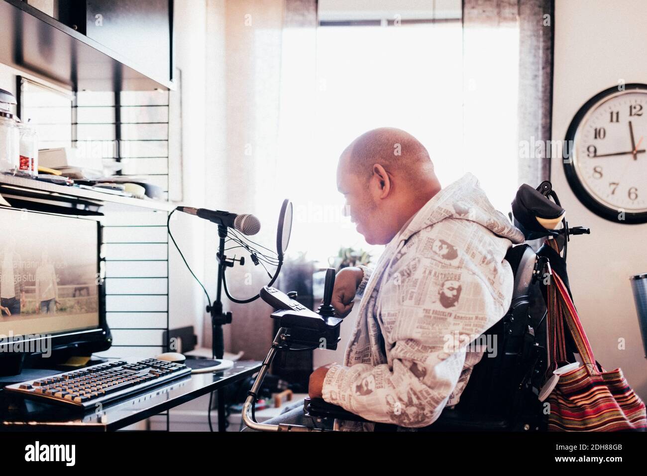 Side view of disabled musician in recording studio Stock Photo Alamy