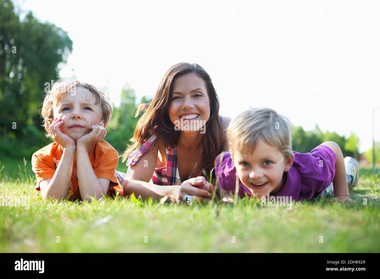 Children lying grass hi-res stock photography and images - Alamy