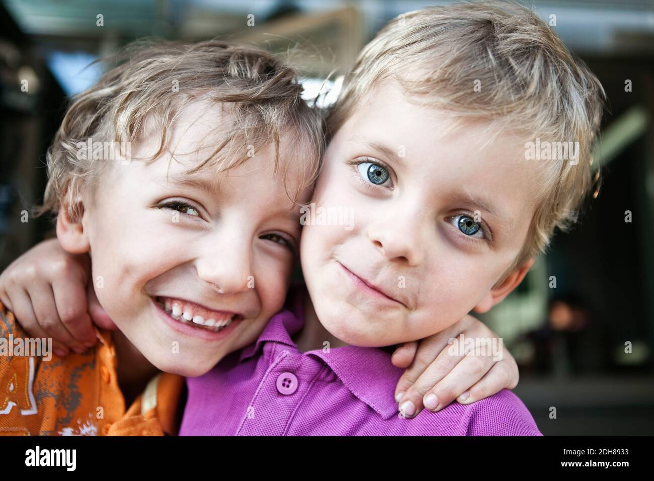 Portrait of a two playful brothers with arms around Stock Photo Alamy