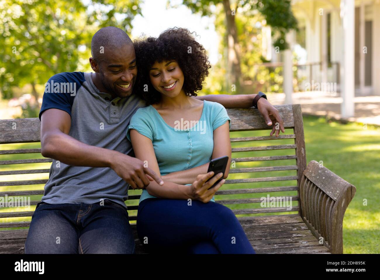 Black man sitting bench trees hi-res stock photography and images - Alamy