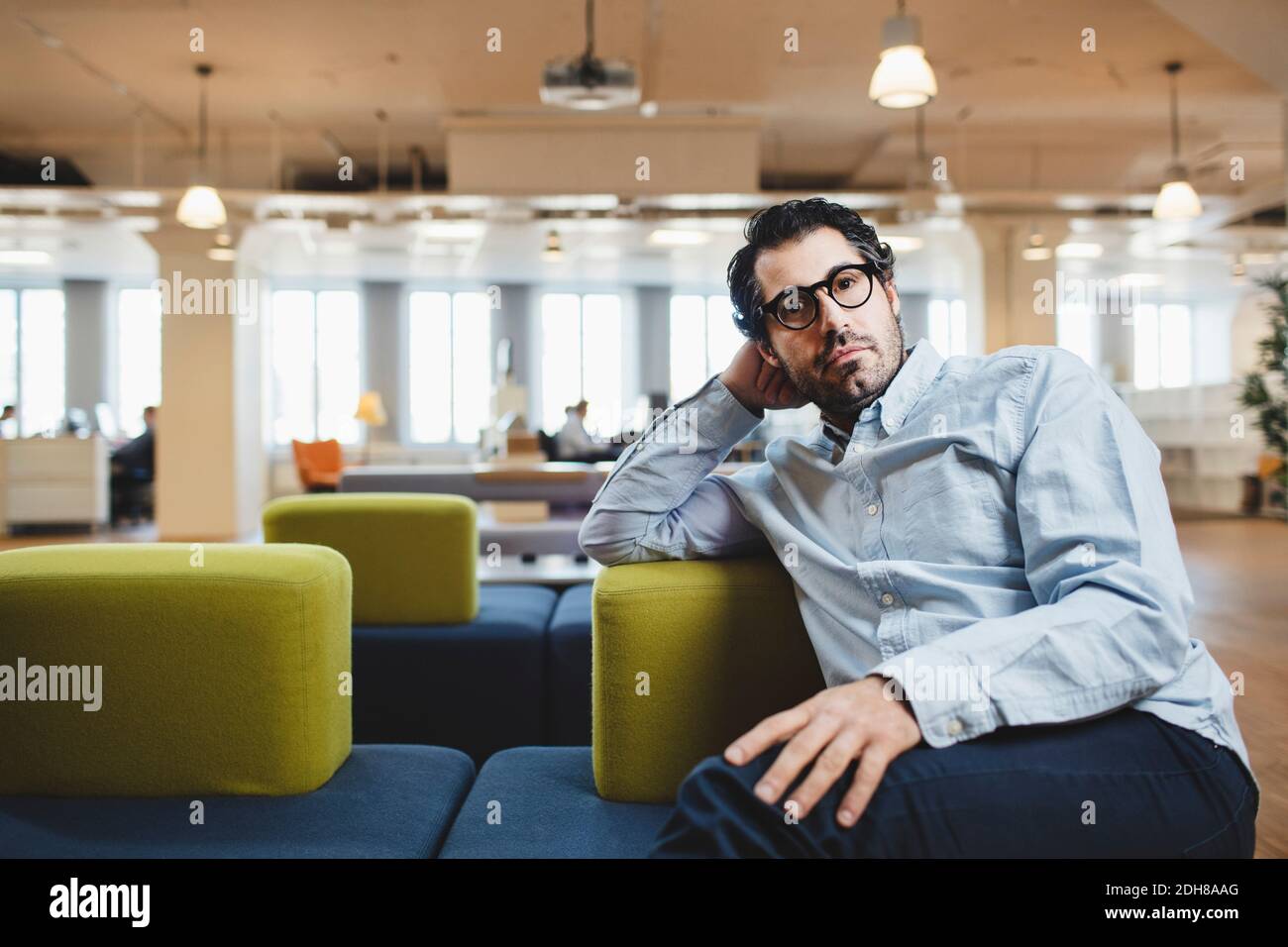 Man sitting couch hi-res stock photography and images - Alamy