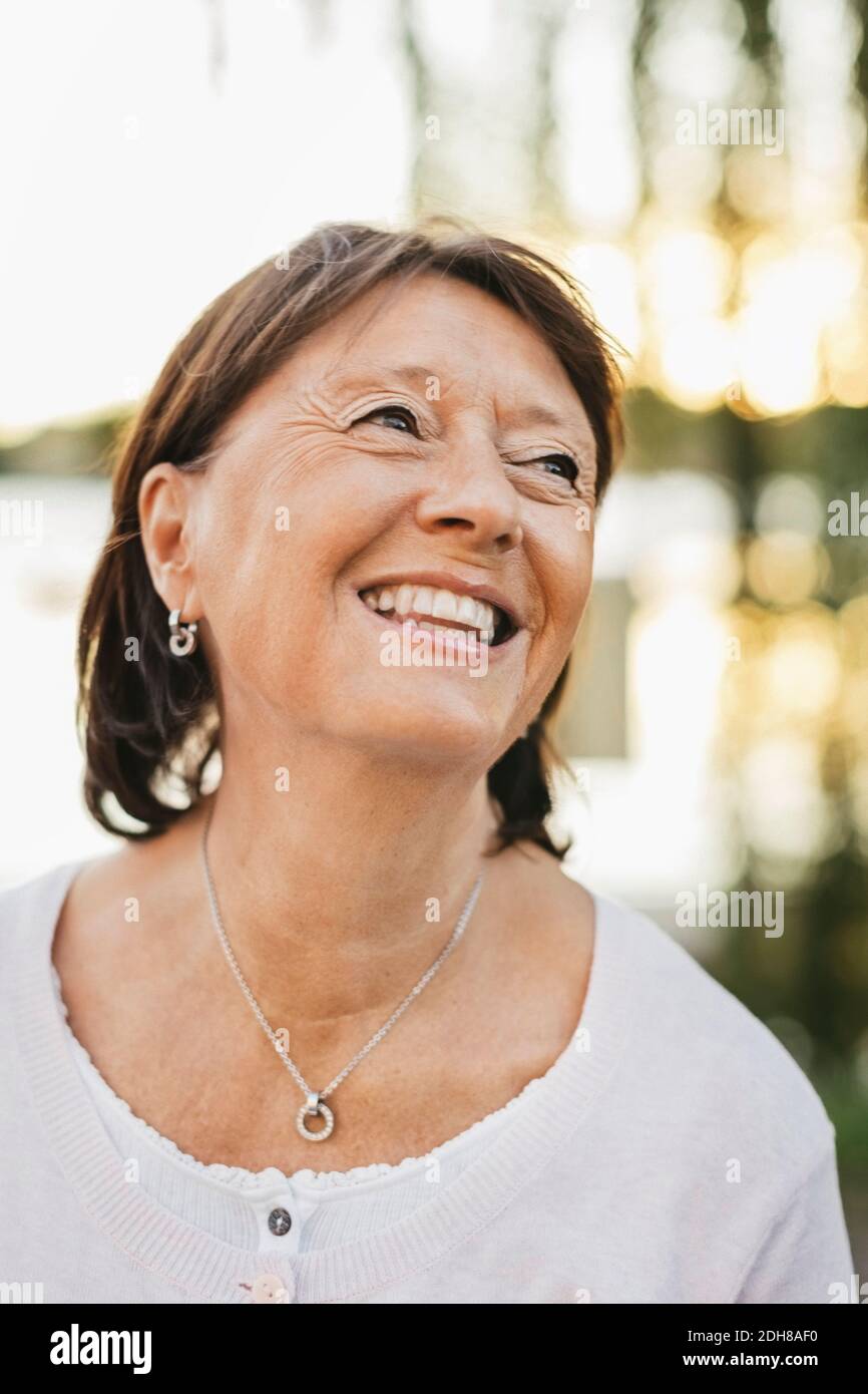 Smiling thoughtful woman hi-res stock photography and images - Alamy