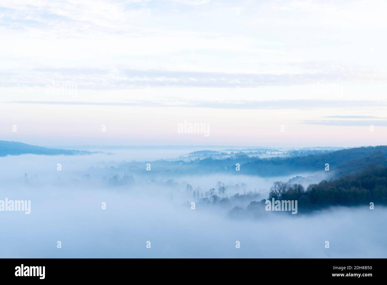 Looking down on fog in a valley Stock Photo