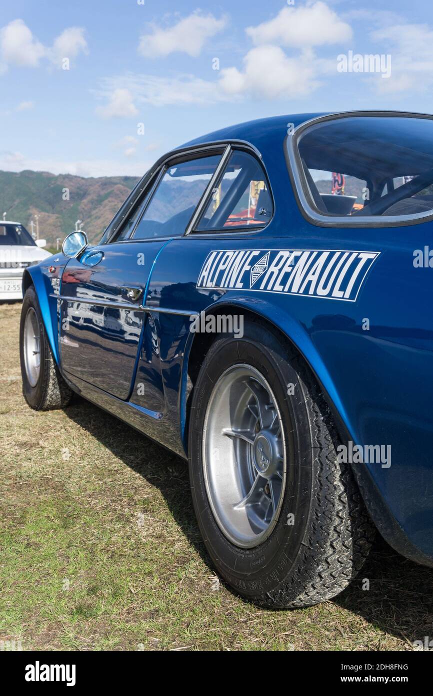 View of the side of a 1973 blue Alpine A110 1600 Si sports coupe looking forward from the rear of the car. Stock Photo