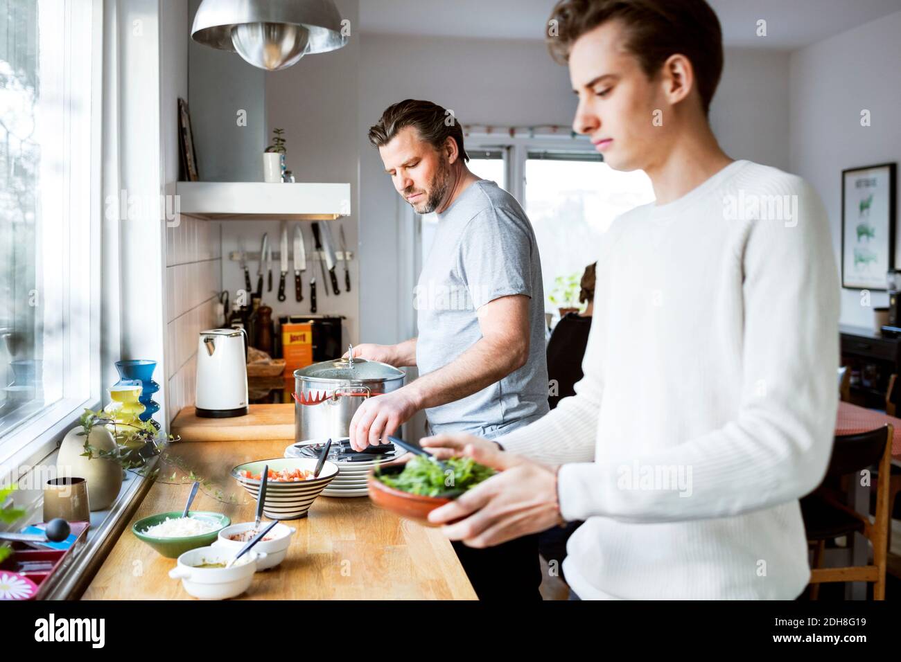 Father and son cooking in kitchen Stock Photo - Alamy
