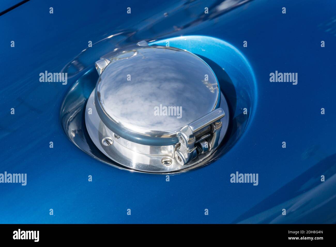 Close up detail of the chrome fuel filler cap on a blue Shelby AC Cobra
