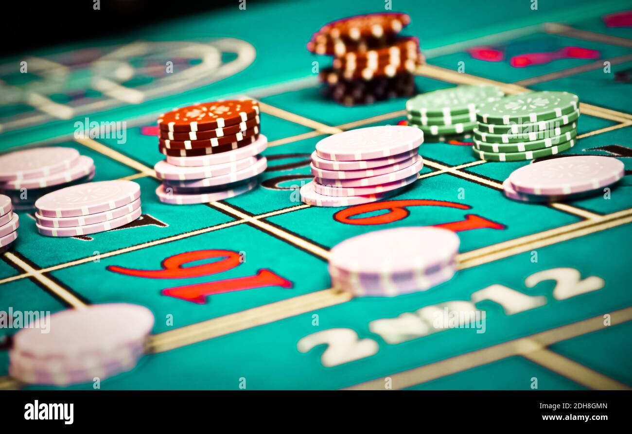 Betting and playing roulette in casino, gambling ad Stock Photo - Alamy