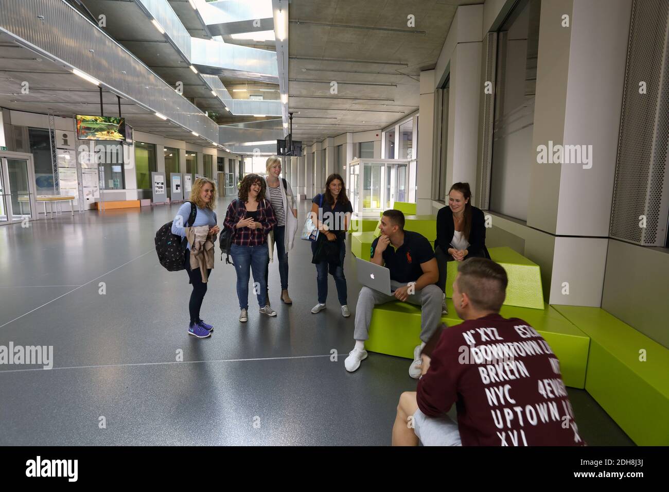 University students talking in a corridor at the University of Giessen , Biomedizinisches Forschungszentrum. Stock Photo