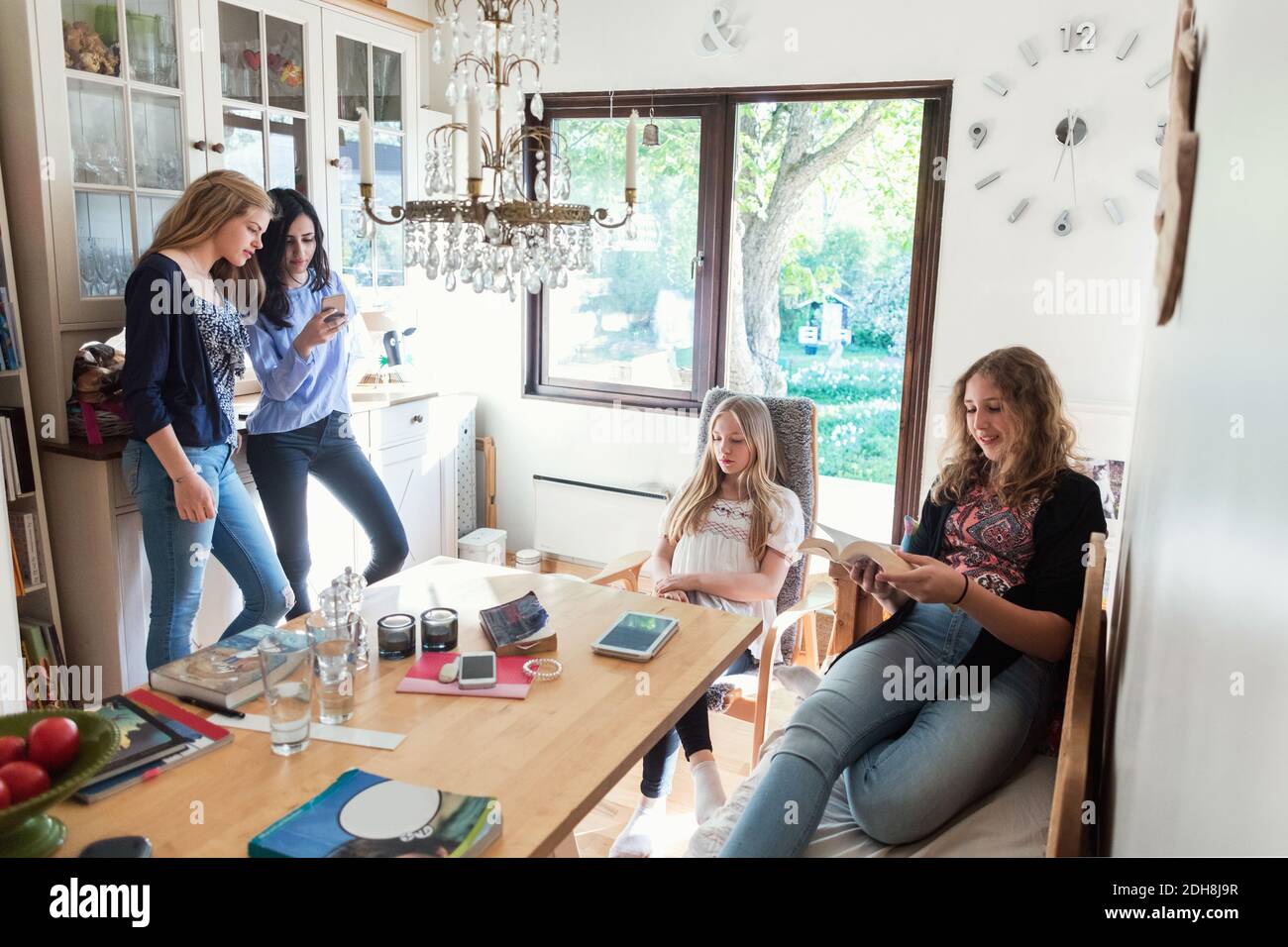 Teenage girls spending leisure time at home Stock Photo
