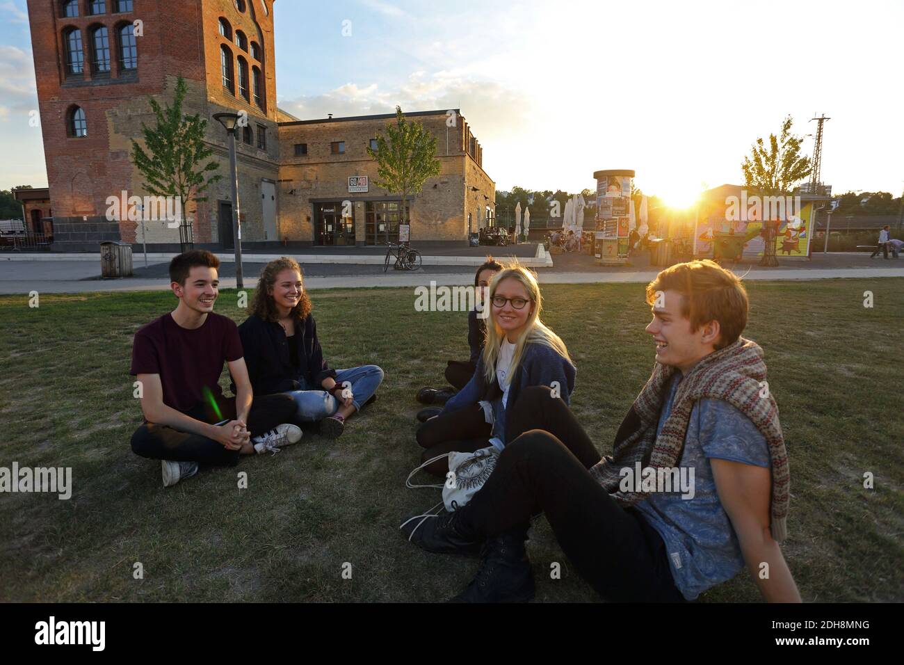 Young people sitting in front of the Old Water Tower, Wiesbaden Germany rhine-main area, greater frankfurt area Stock Photo