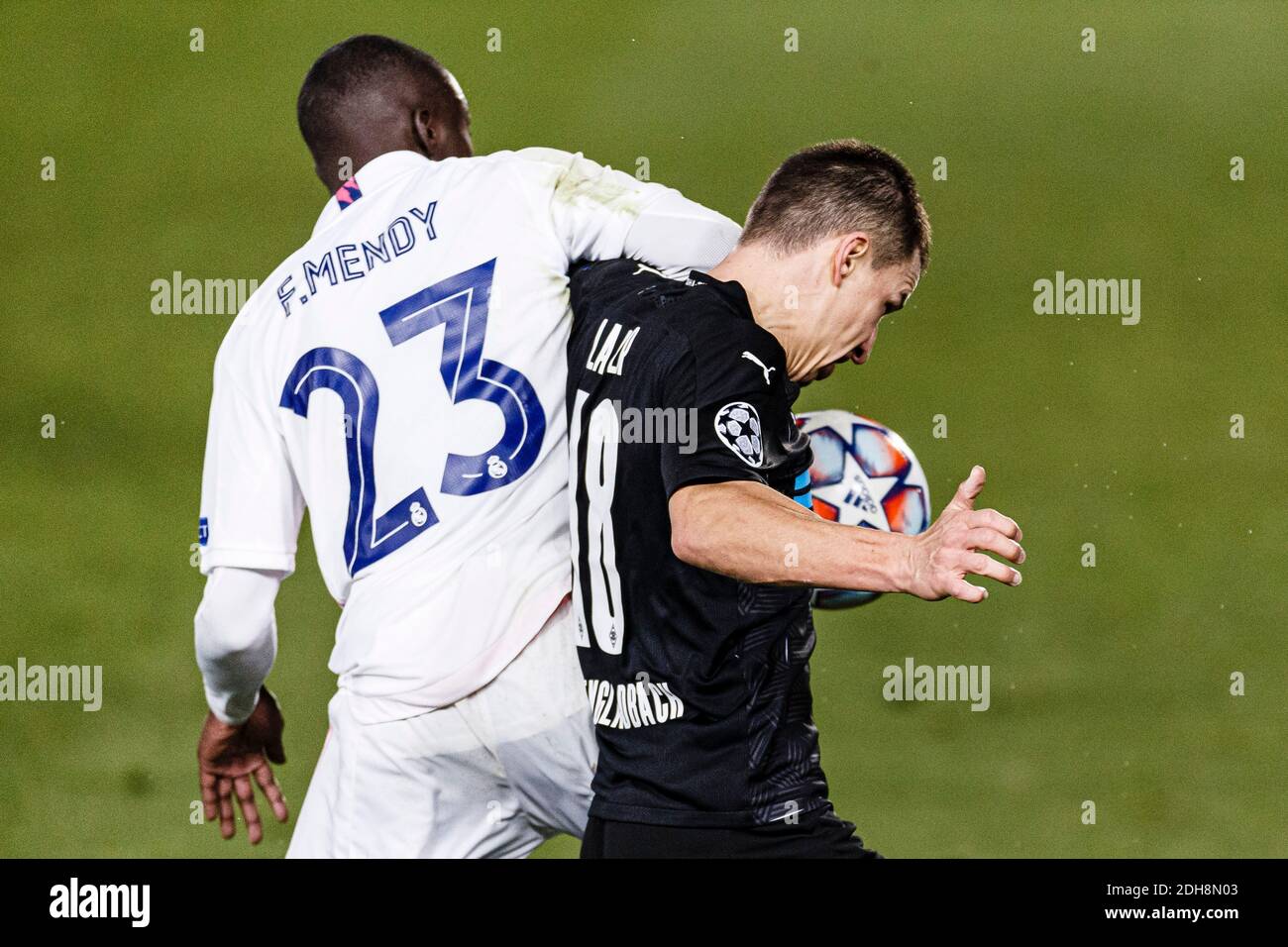 Madrid, Spain. 9th Dec, 2020. Ferland Mendy of Real Madrid (L) battles for the ball with Stefan Lainer of Monchengladbach (R) during the UEFA Champion Stock Photo
