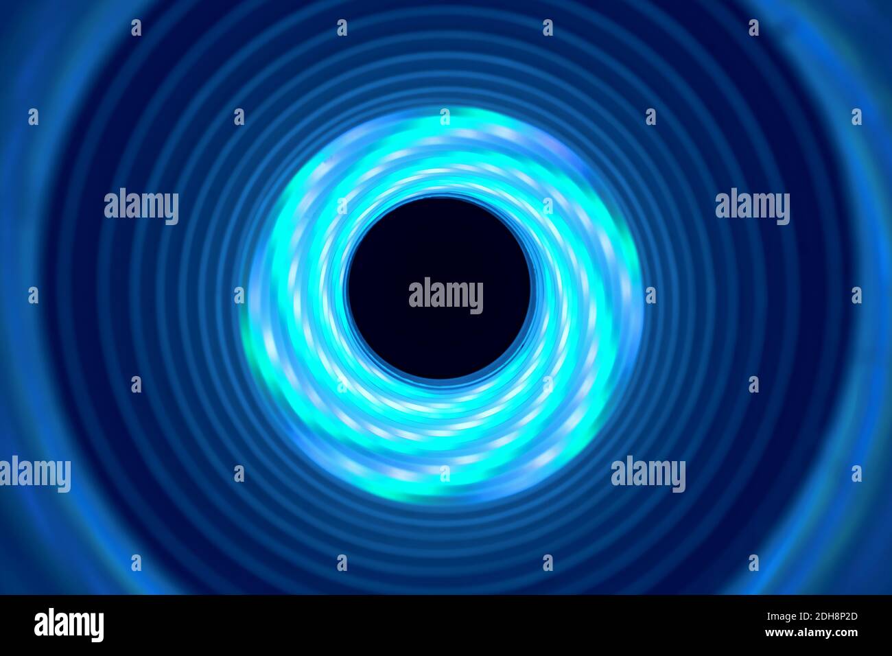 Beautiful abstract swirl tunnel with aqua-blue neon light on a ...