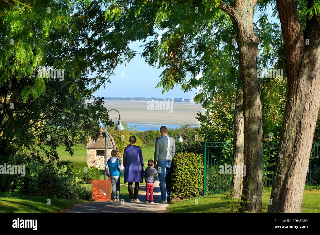 Somme Bay (northern France): family with two children walking on at a path in Saint-Valery-sur-Somme, along the coastal area “cote d’Opale” Stock Photo