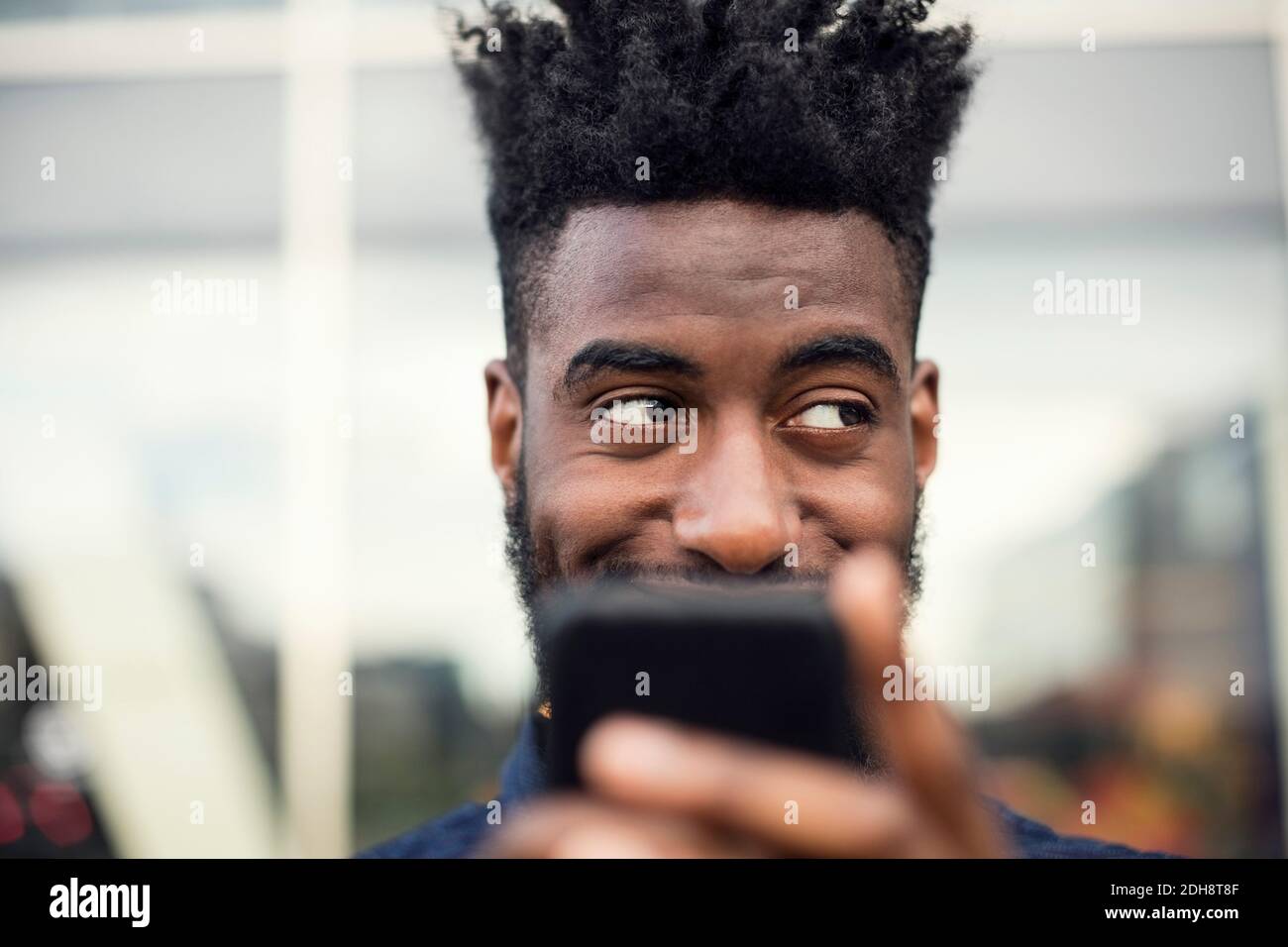 Happy man using smart hi-res stock photography and images - Alamy