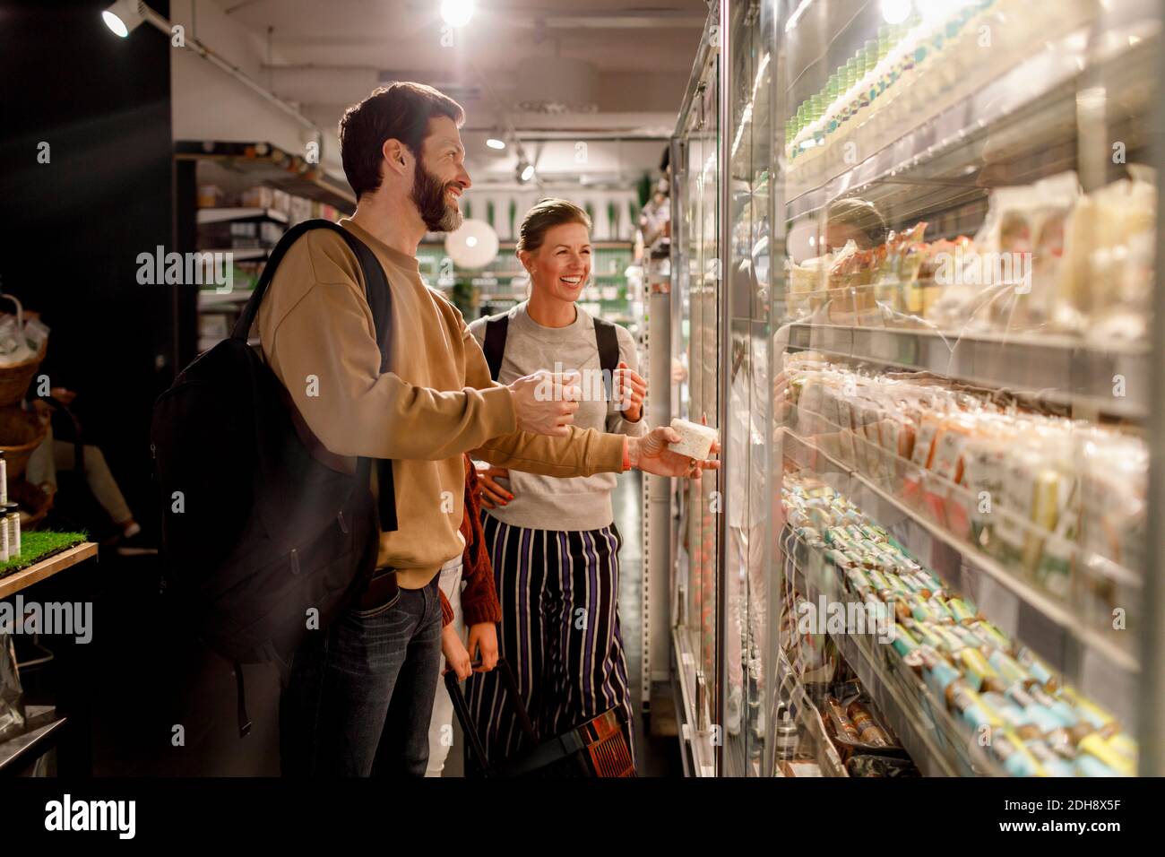 Smiling couple shopping in supermarket Stock Photo