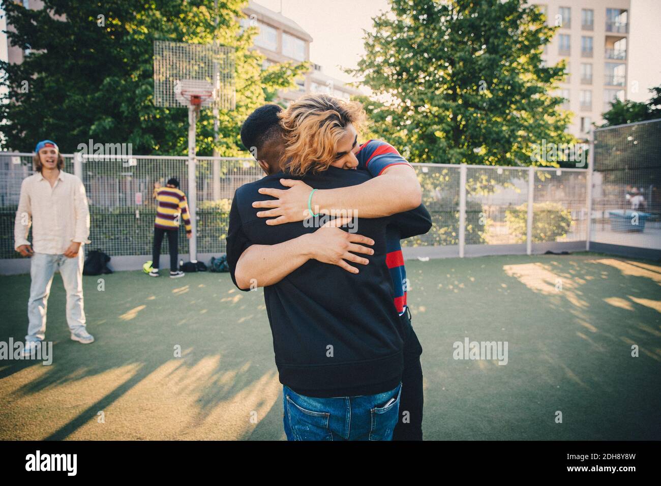 Arm around each other and boys hi-res stock photography and images - Alamy
