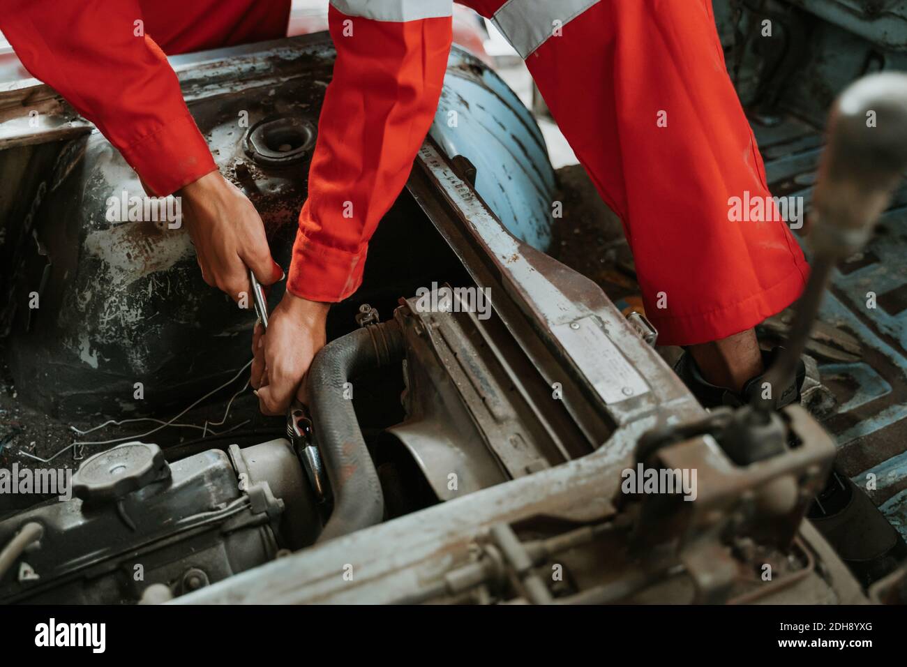 portrait of young asian man repairing a broken car engine part Stock ...