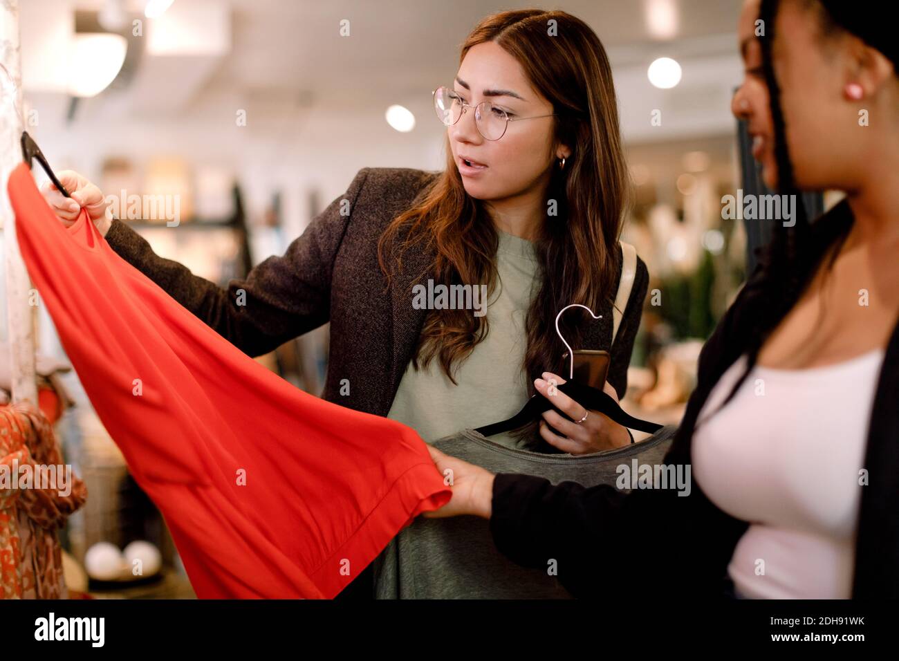 Female friends shopping at retail store Stock Photo