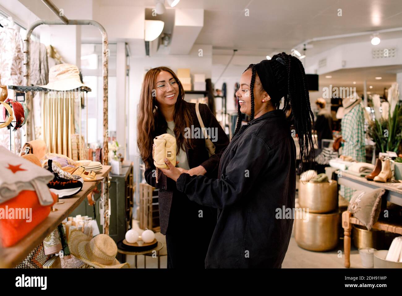 Happy friends shopping at retail store Stock Photo