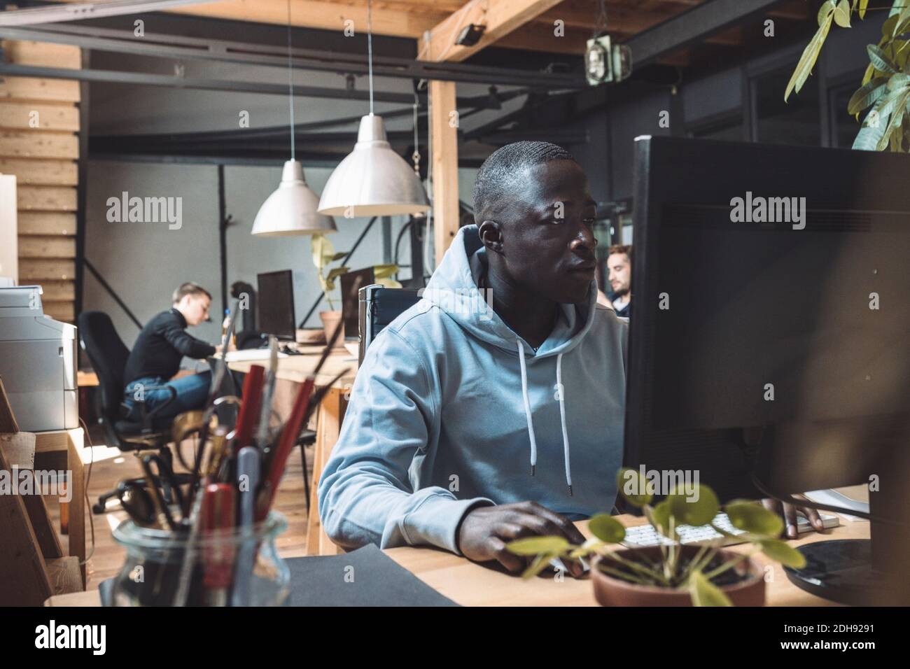 Businessman working on computer at workplace Stock Photo