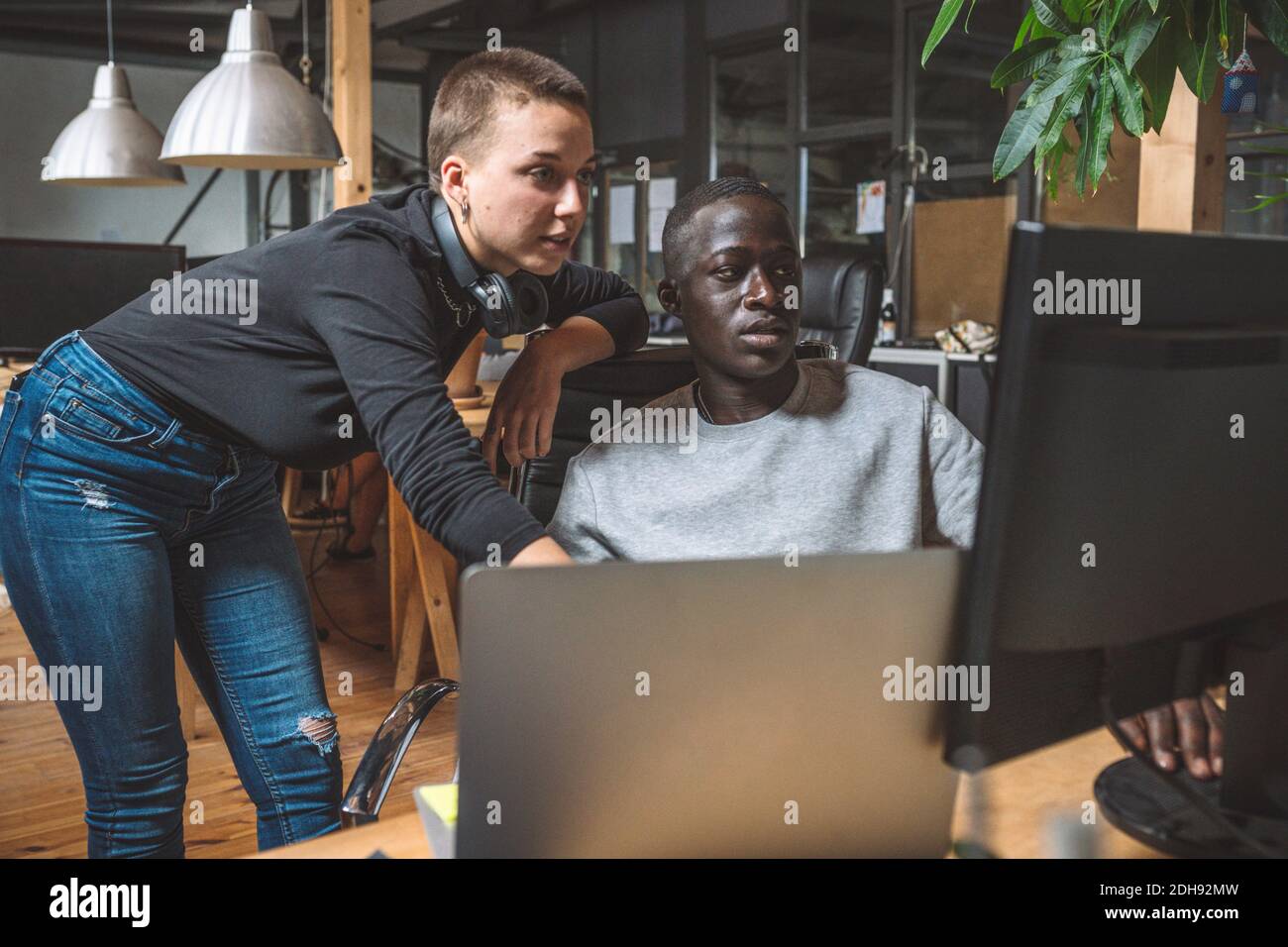 Computer programmers working on computer at workplace Stock Photo