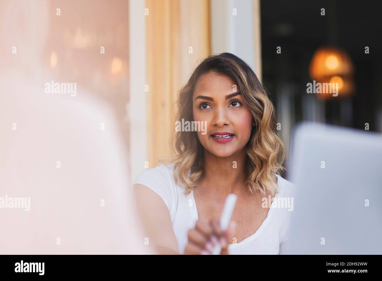 Female business colleagues discussing at restaurant during meeting Stock Photo