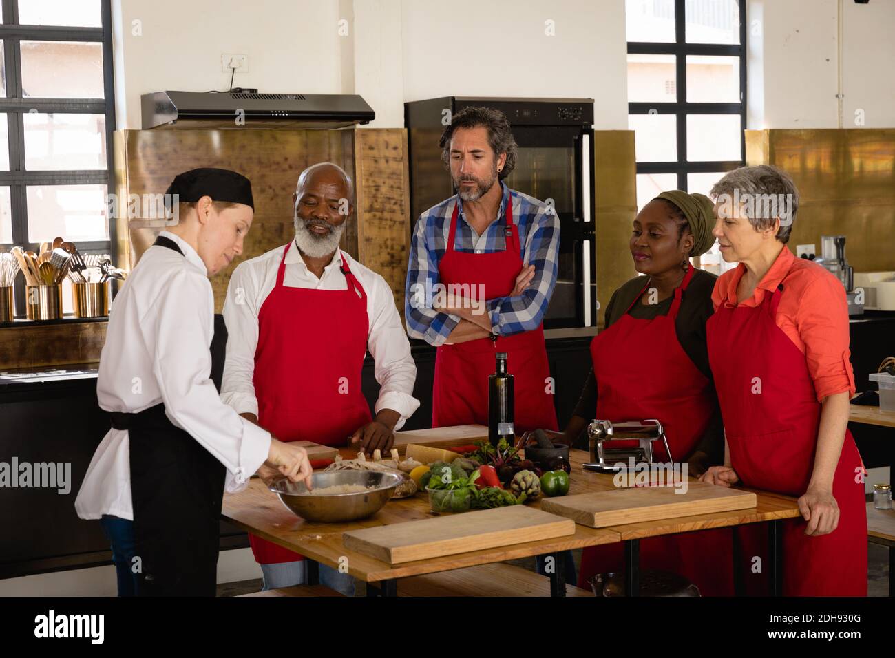 Chef explaining while cooking Stock Photo Alamy