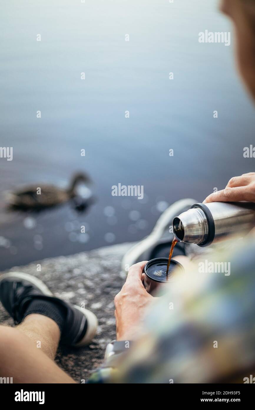Man sitting on lake hi-res stock photography and images - Alamy