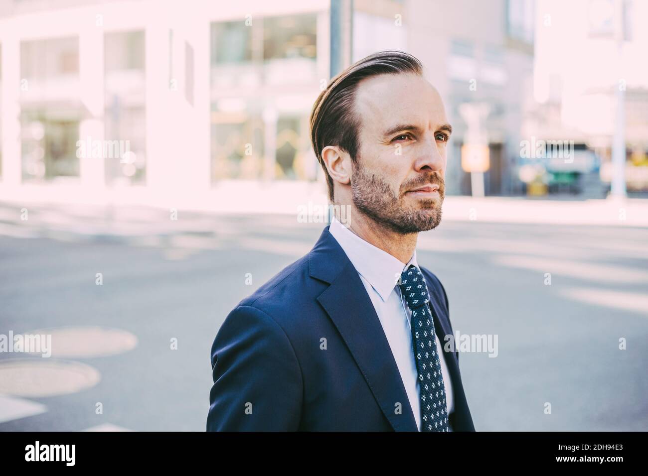 Businessman looking away in city Stock Photo