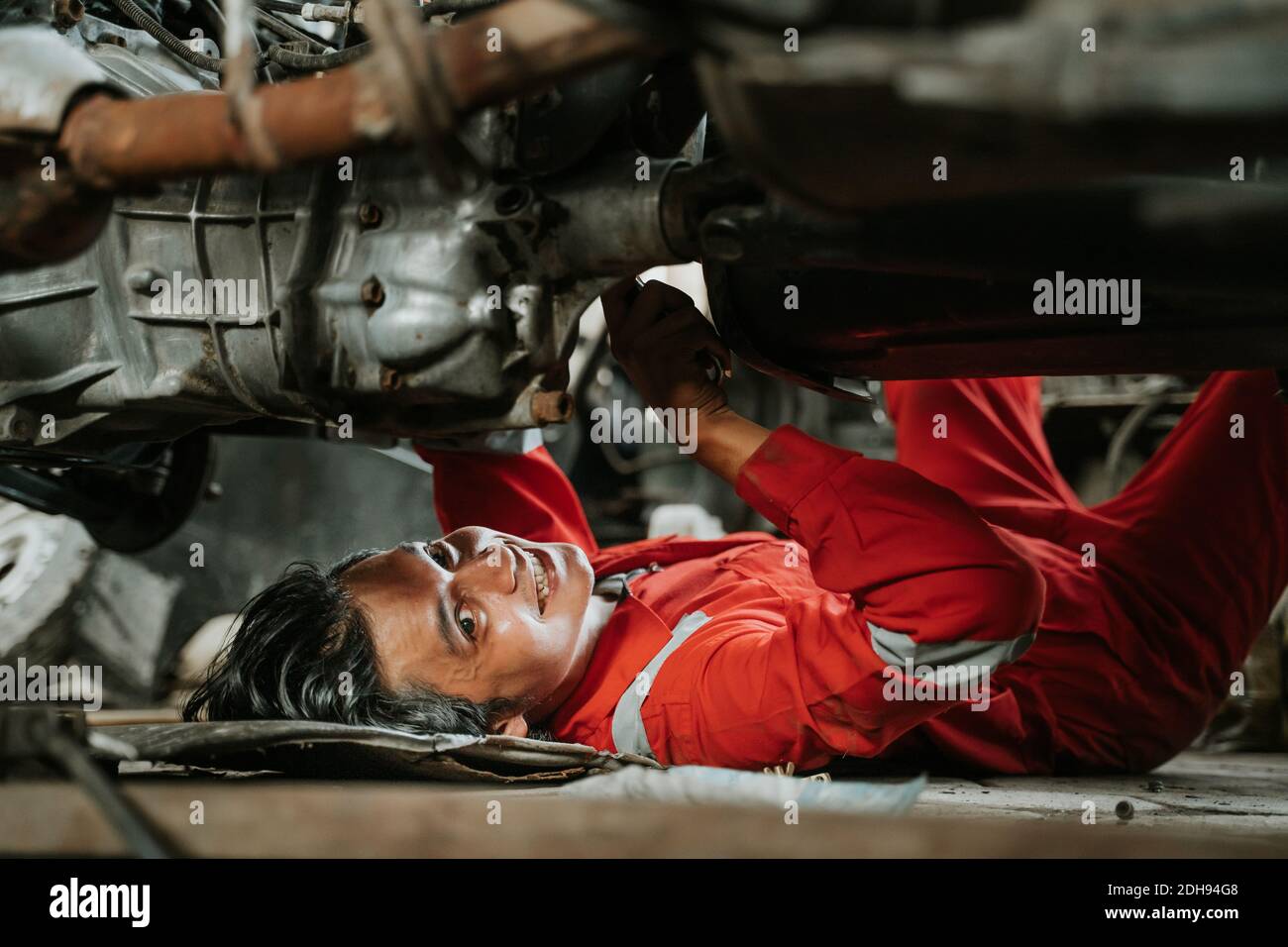 portrait of young asian man repairing a broken car engine part Stock ...