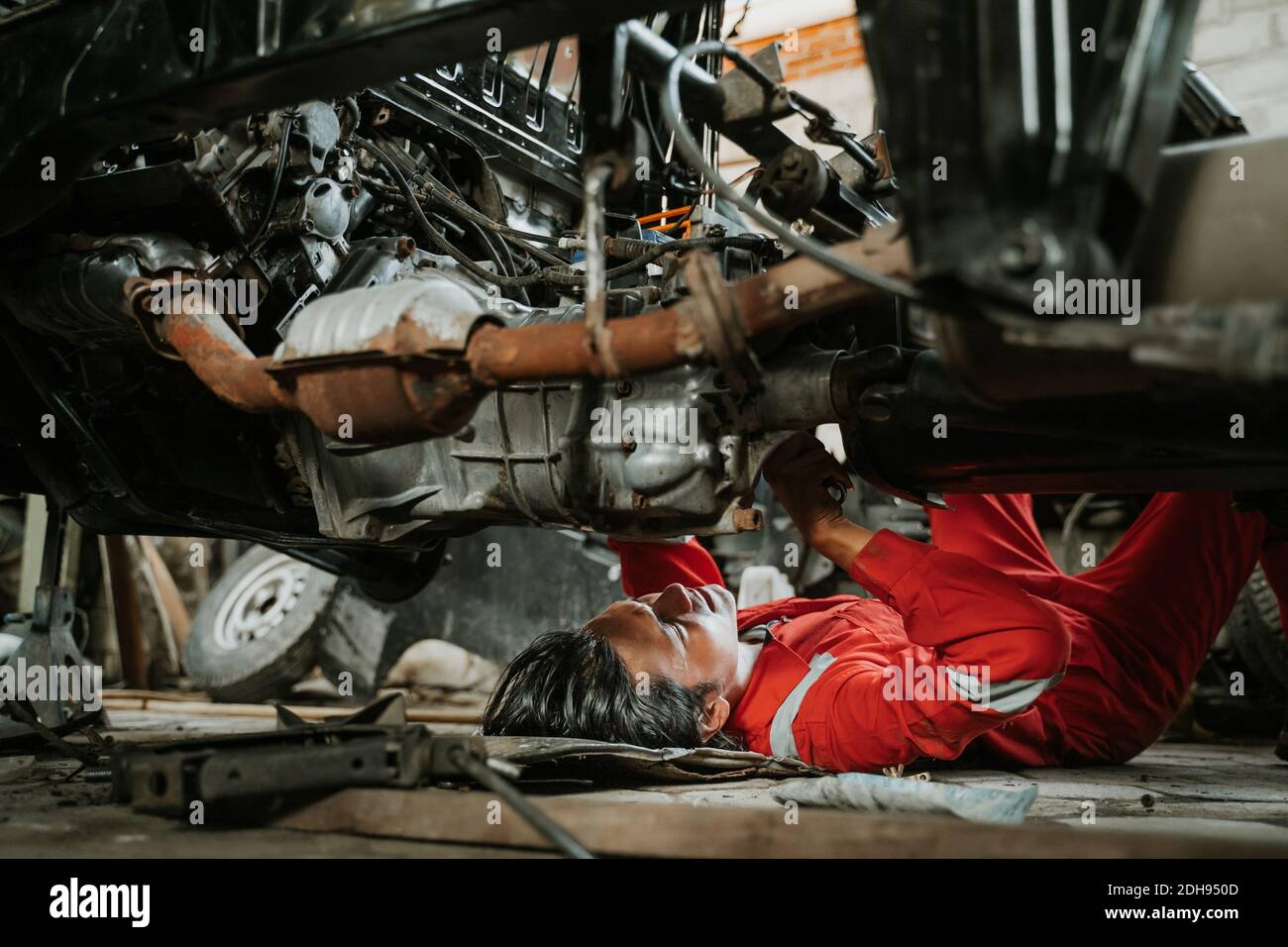 portrait of young asian man repairing a broken car engine part Stock ...