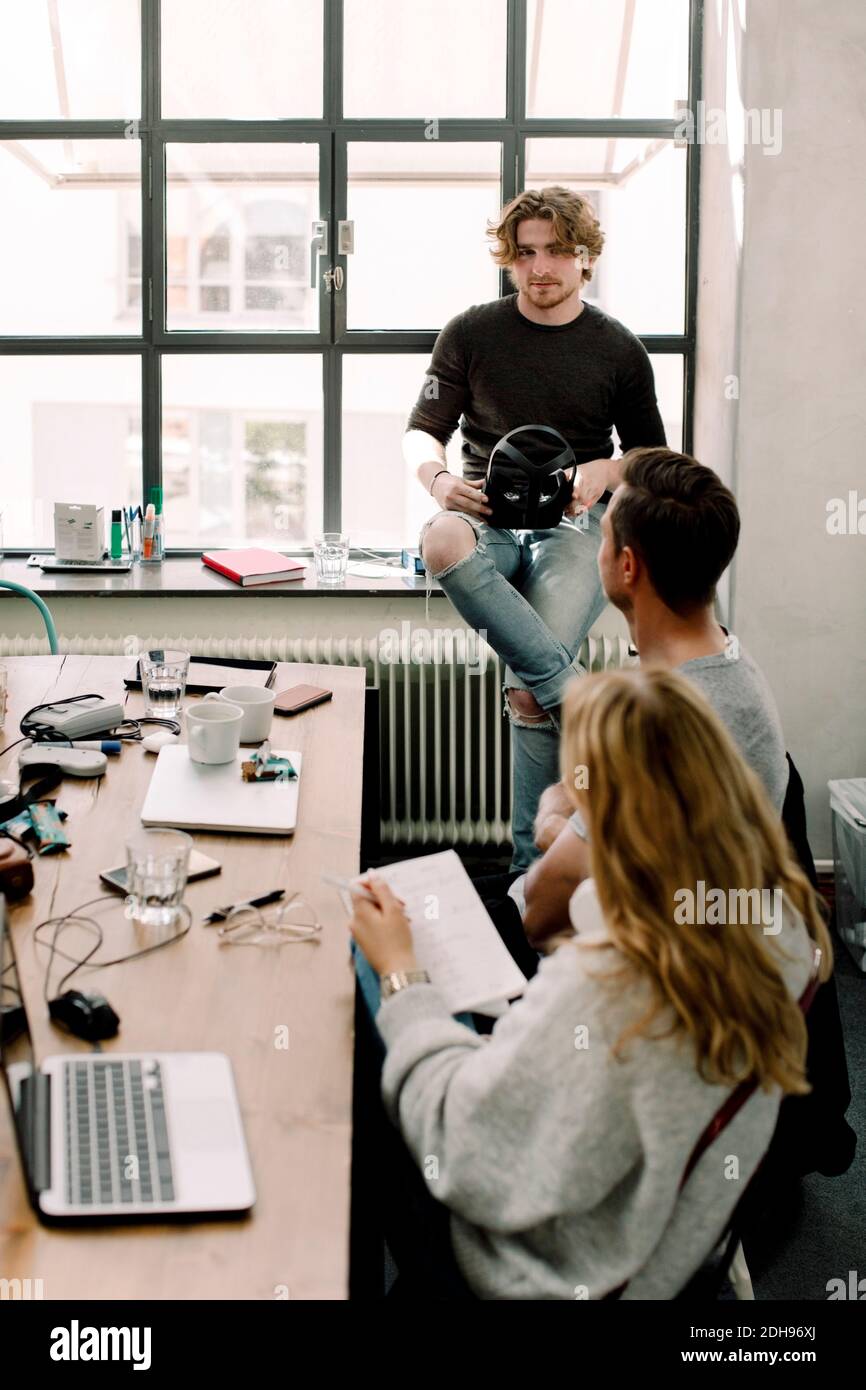 Business people discussing at workplace Stock Photo