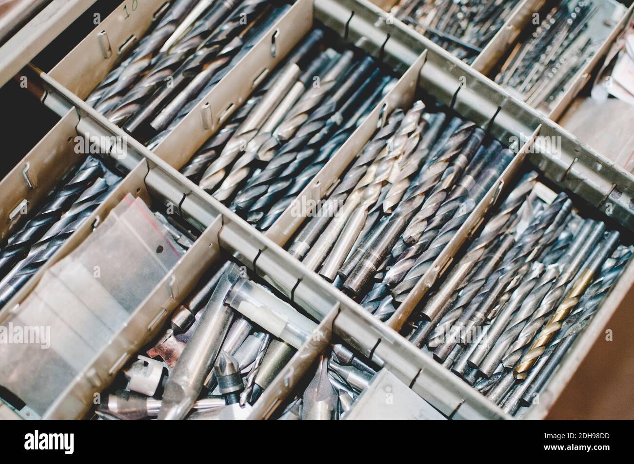 High angle view of drill bits in toolbox Stock Photo Alamy