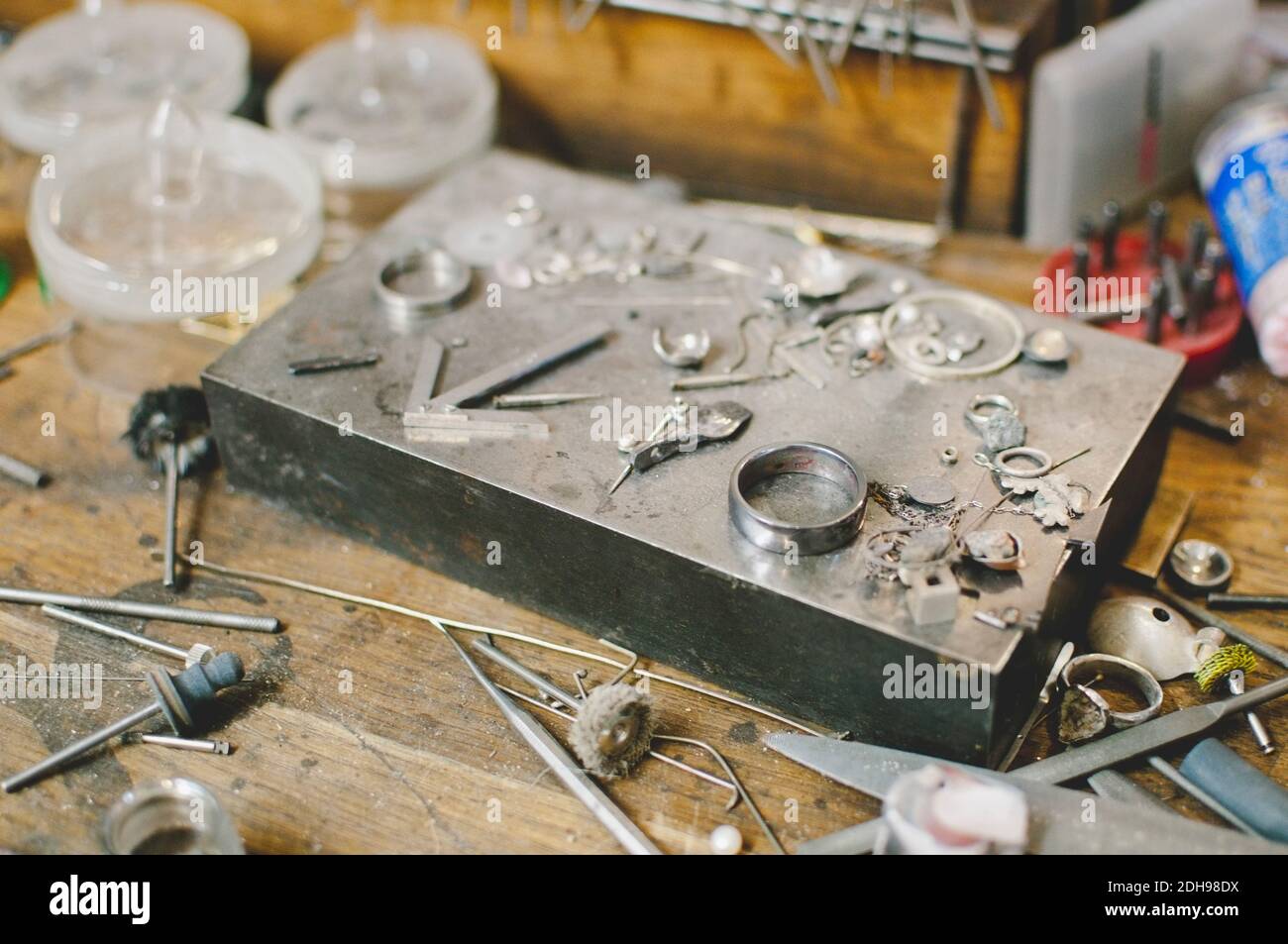 Jewelry making tools on workbench in workshop Stock Photo
