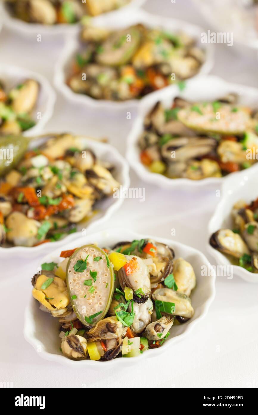 Many dishes of appetizer of mussels Stock Photo Alamy