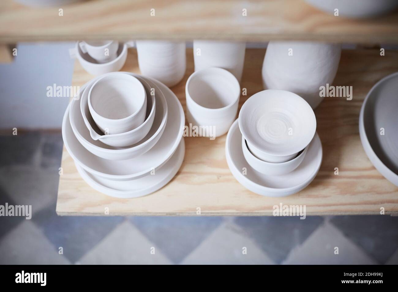 High angle view of earthenware on shelf Stock Photo
