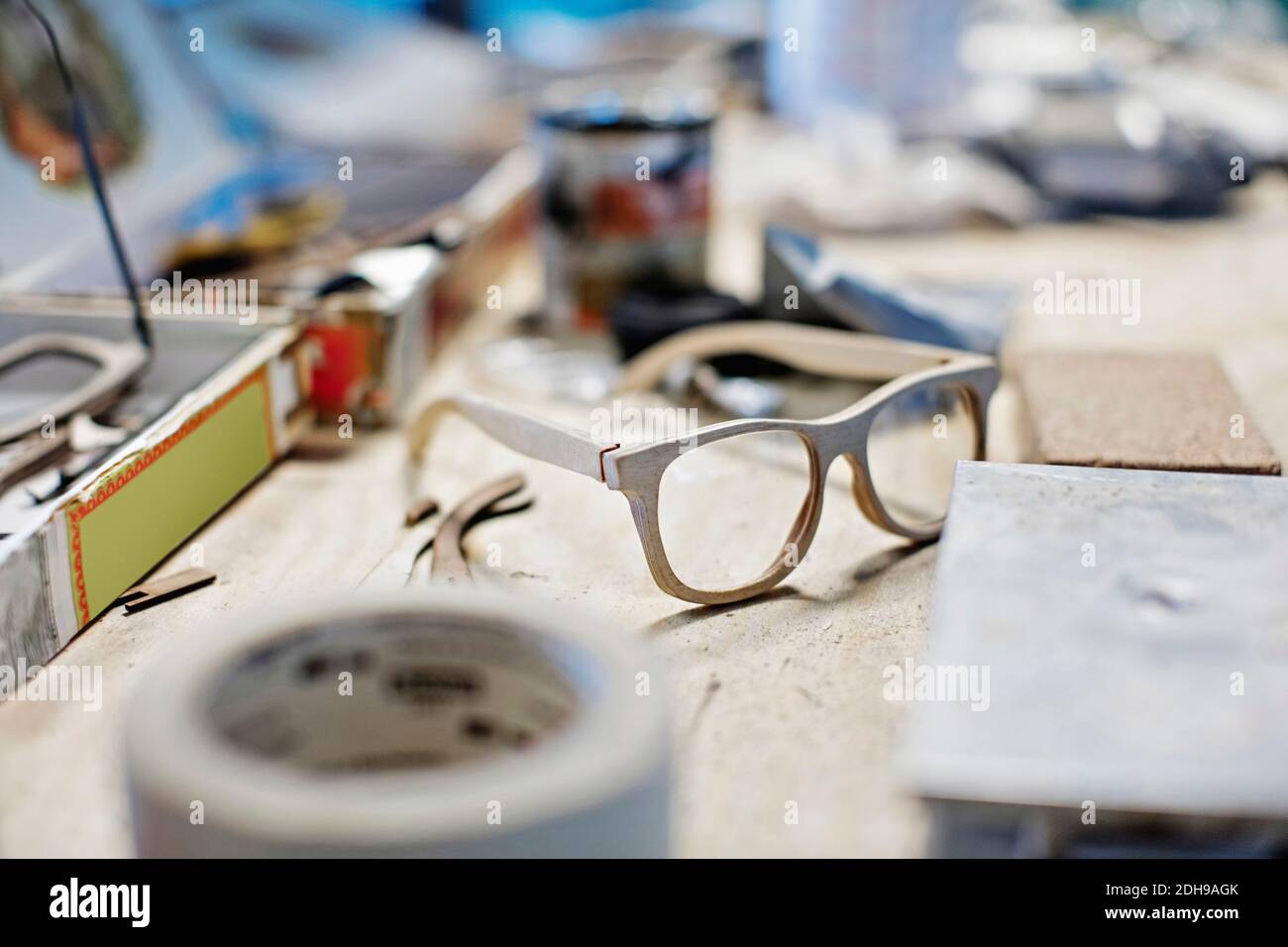 Eyewear frame on table at workshop Stock Photo
