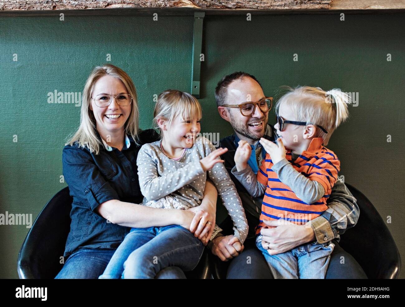Happy family at eyeglasses workshop Stock Photo