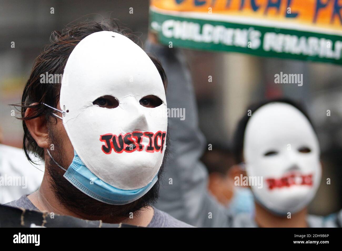 Manila, Philippines. 10th December 2020. Protesters wearing masks and practicing physical distancing hold their placards with different messages during the International Day of Human Rights Rally. The people are calling for the administration of President Rodrigo Duterte to stop the killings and free political prisoners. Credit: Majority World CIC/Alamy Live News Stock Photo