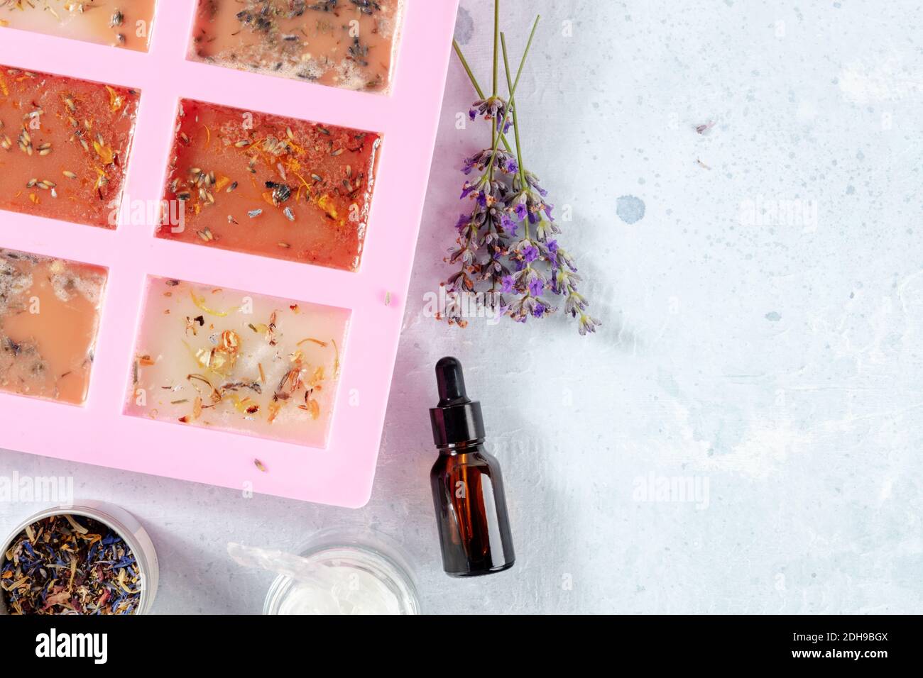 Handmade soap, the process of making. Glycerin with herbs, poured into a special mold for drying