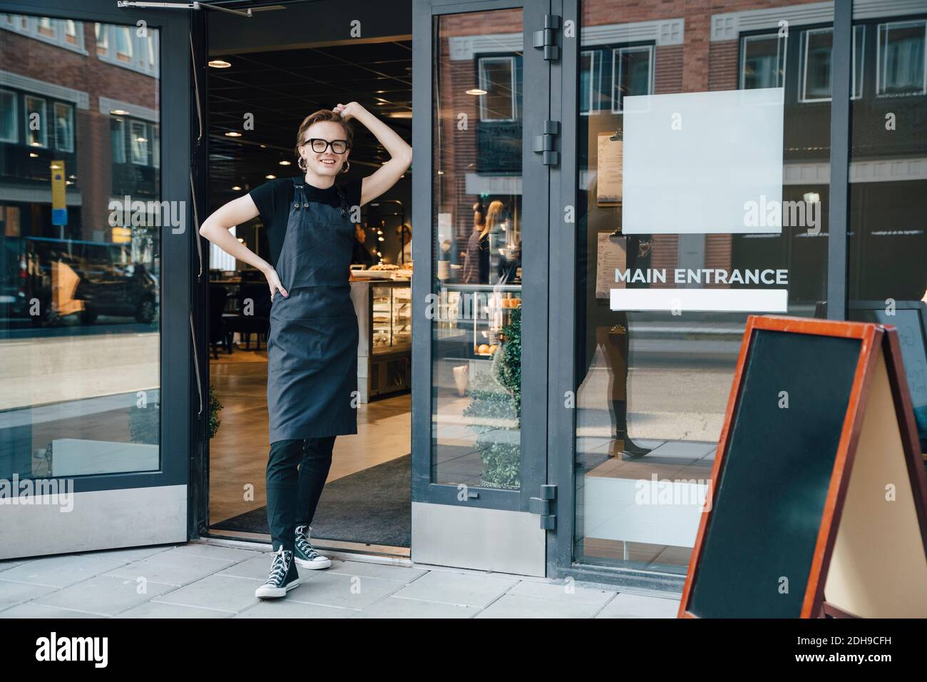 Smiling young barista in hi-res stock photography and images - Alamy