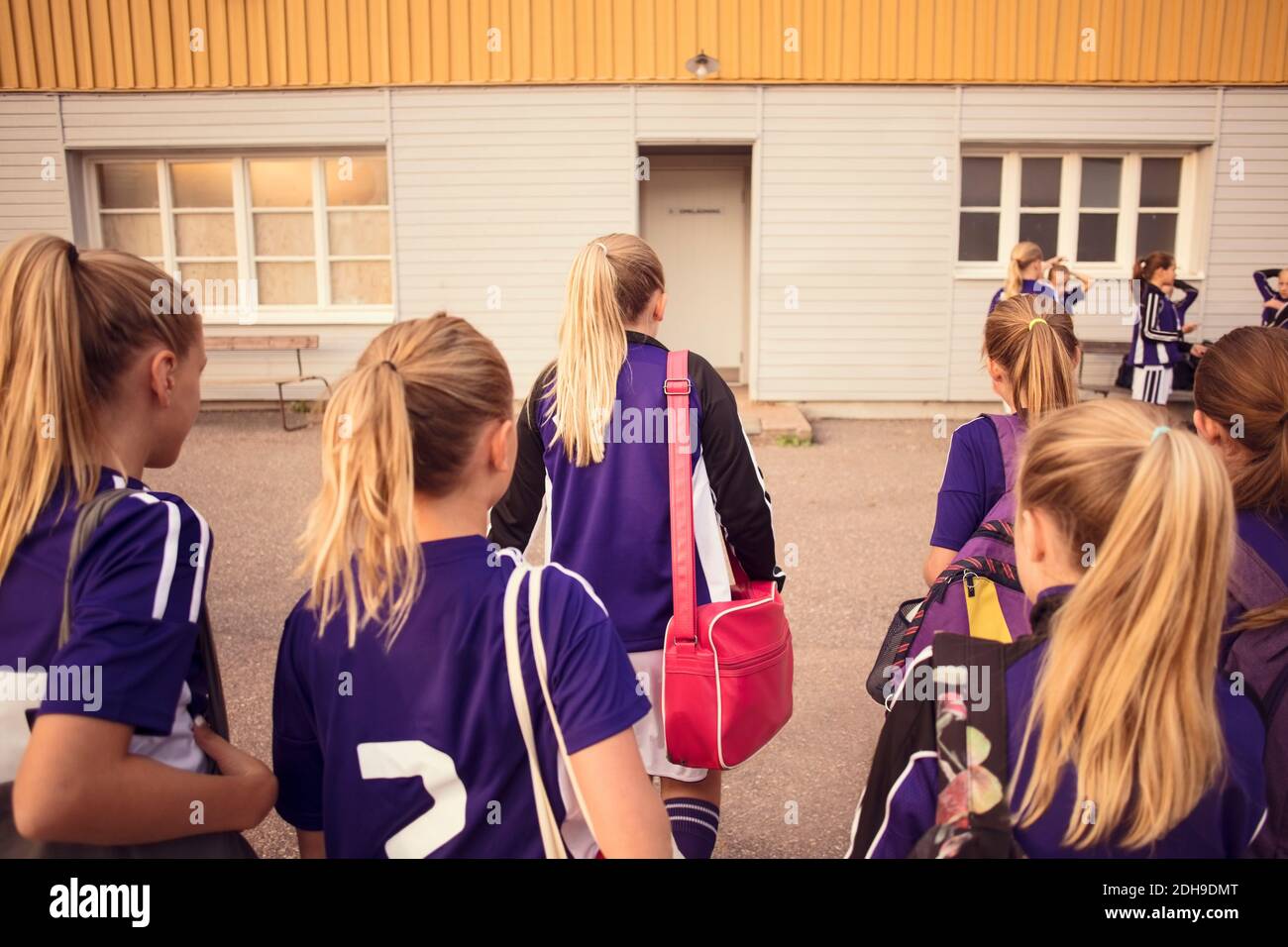 Rear view girls walking outdoors hi-res stock photography and images ...