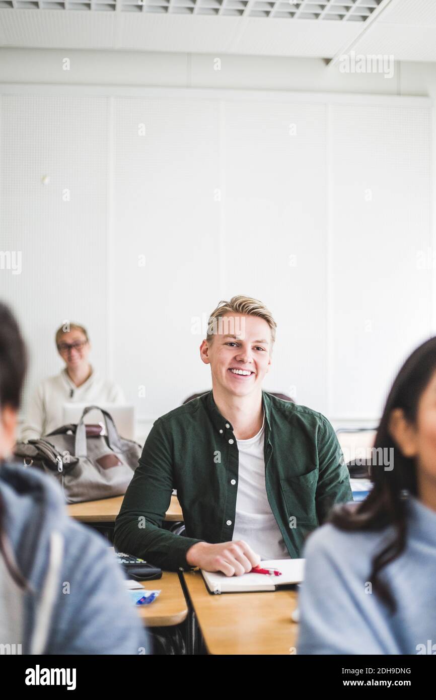 Young smiling man sitting indoors hi-res stock photography and images ...