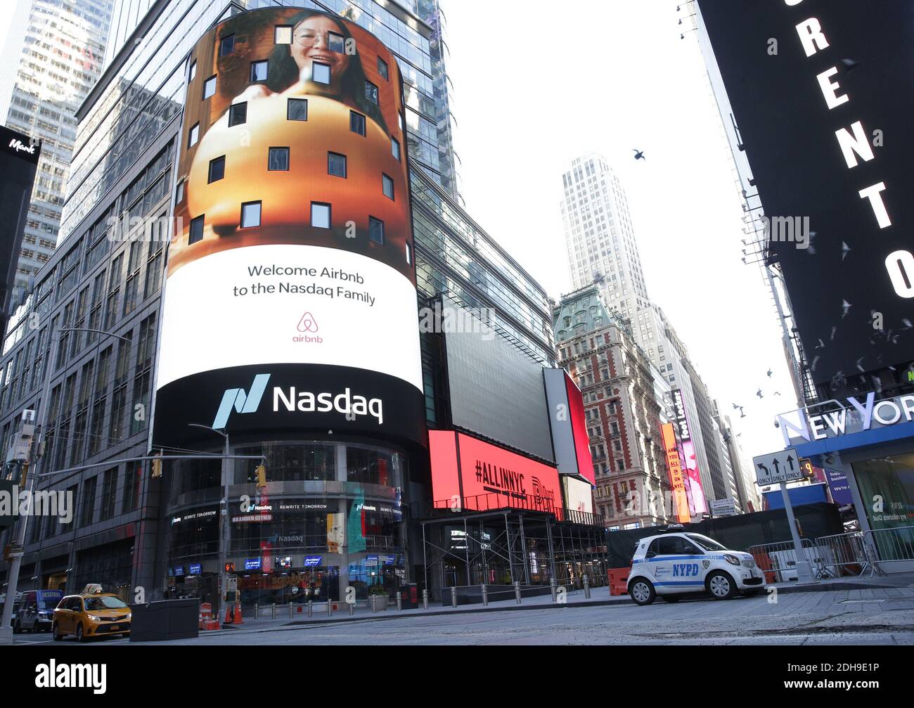 New York, USA. 14th Apr, 2021. Workers and supporters outside the giant  video screen on the Nasdaq stock exchange in Times Square in New York  decorated for the debut of the Coinbase