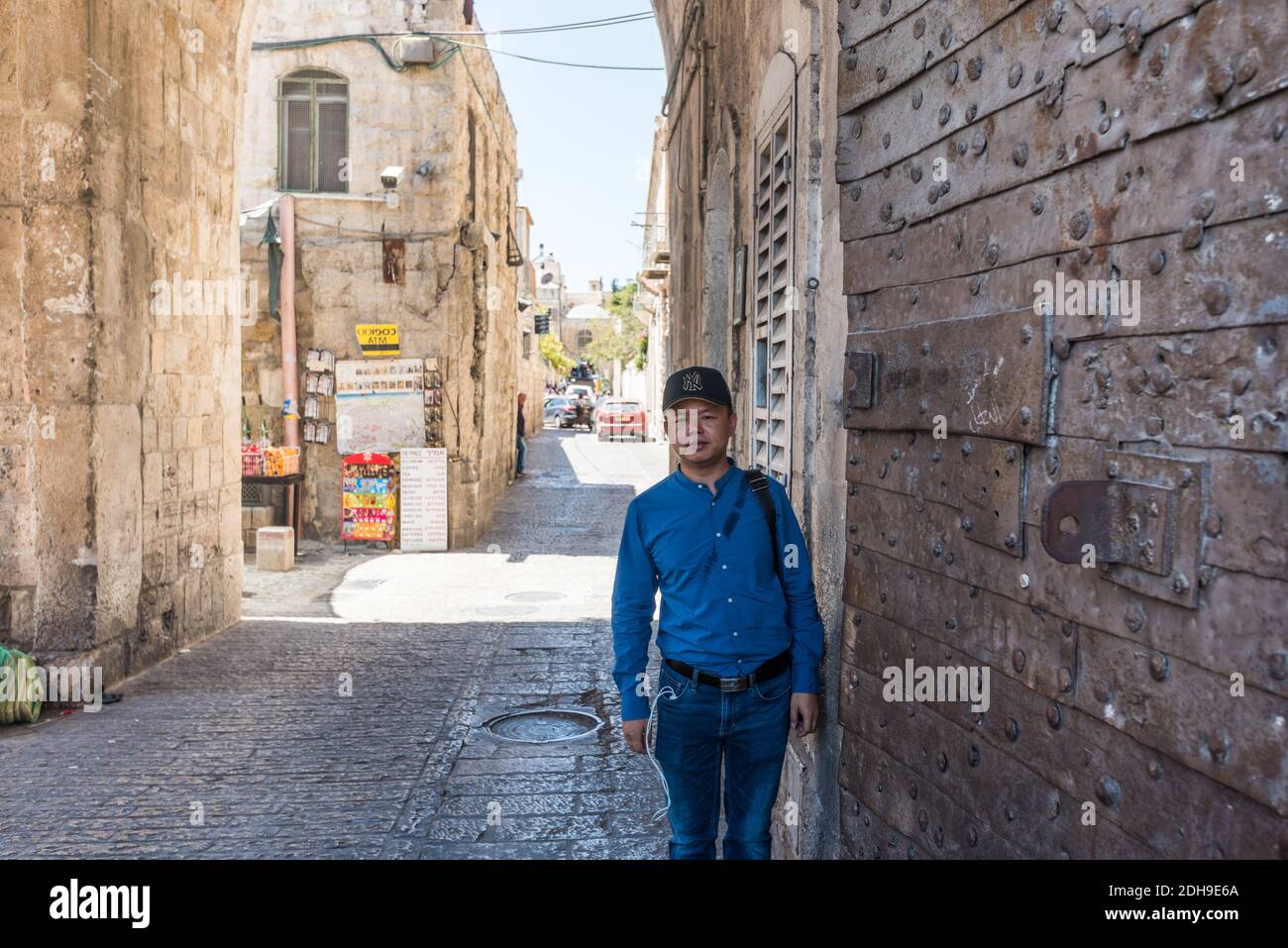 A Chinese tourist at the Lions' Gate,  St. Stephen's Gate ocated in the Eastern Wall, Islamic quarter, the entrance marks the beginning of the Via Dol Stock Photo