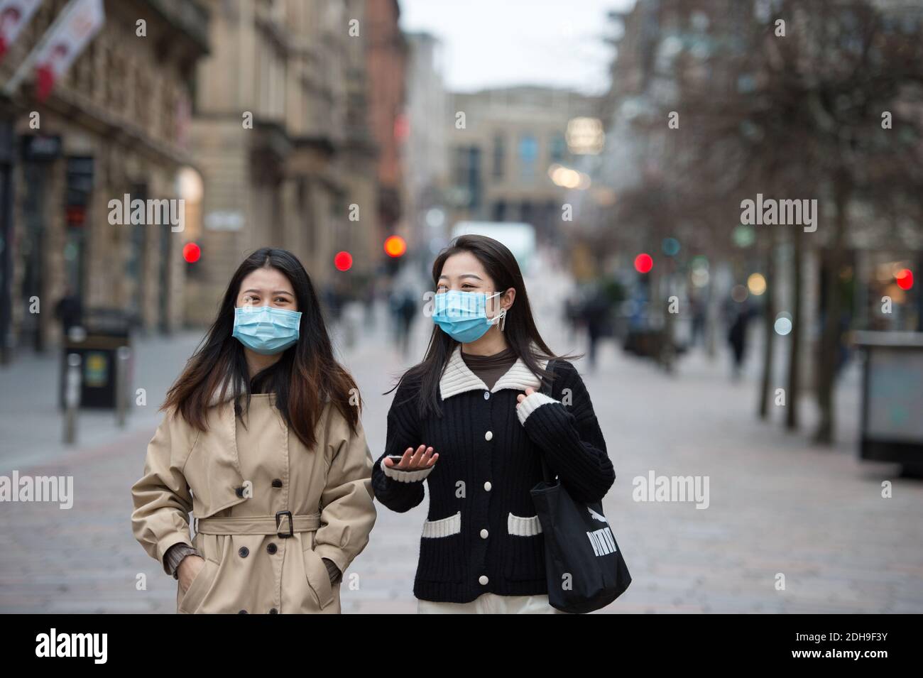 Oriental people wearing blue surgical face masks hires stock photography and images Alamy