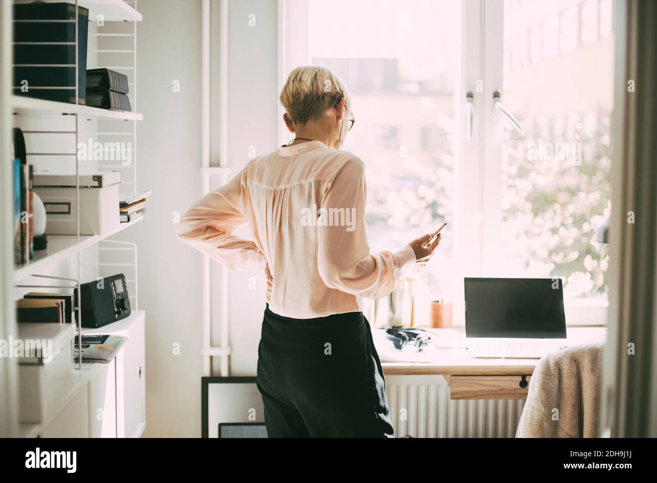 Talking on the phone rear view hi-res stock photography and images - Alamy