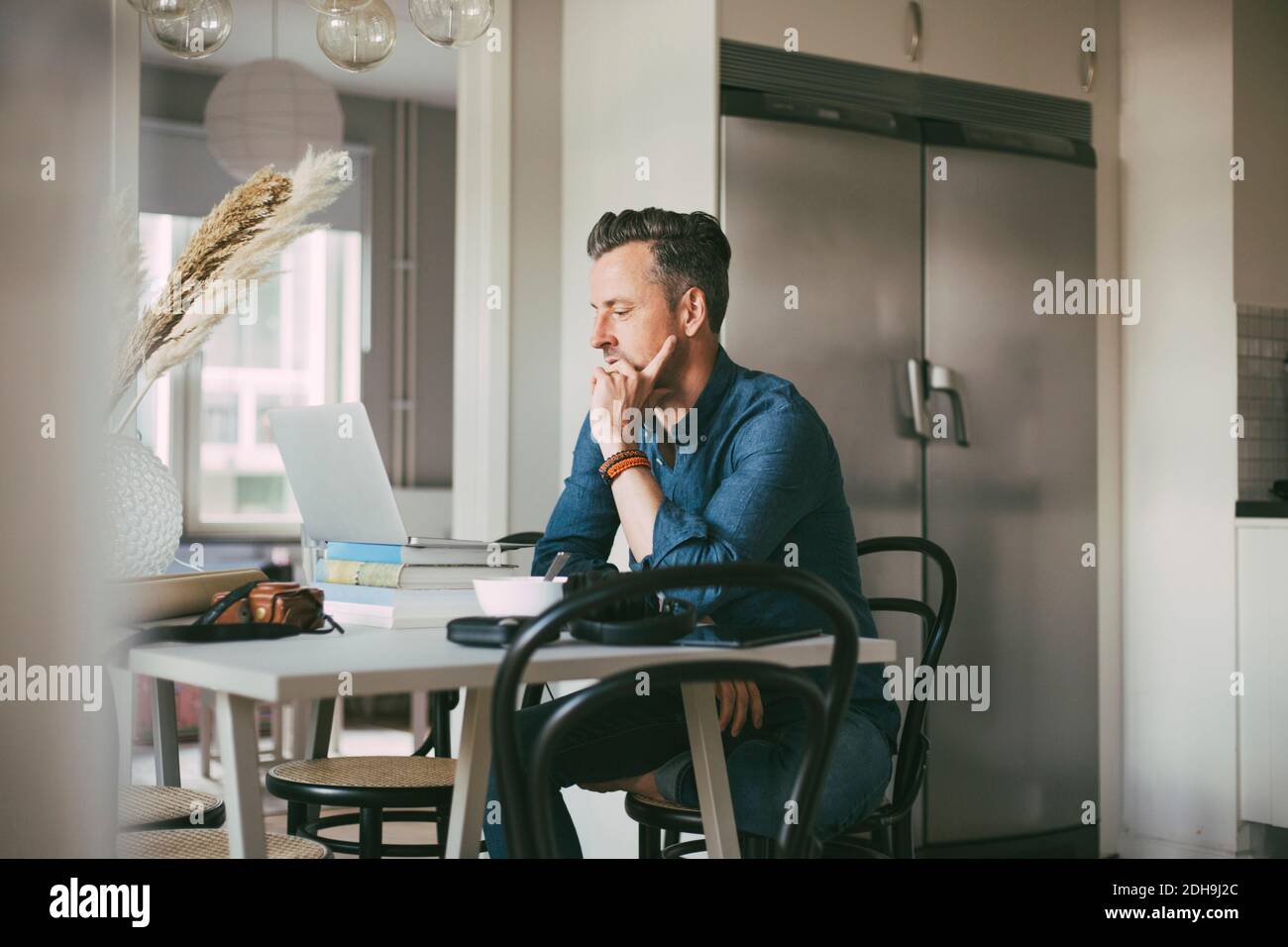 Man having video chat working at home Stock Photo