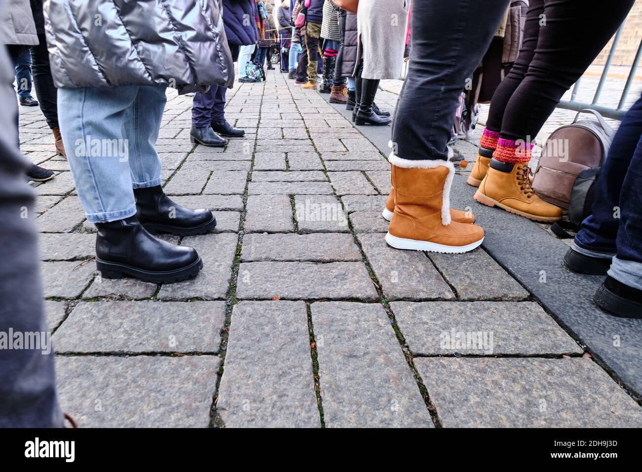 Self-distancing people on the public celebration on the street during the COVID-19 Pandemic. Stock Photo